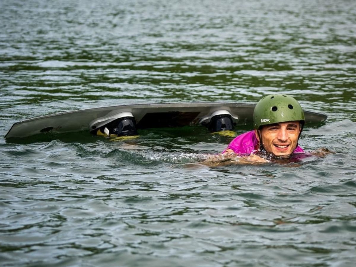 Male competitor in the water smiling